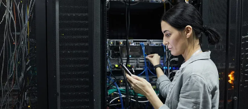 female network technician conducting IT infrastructure lifecycle management